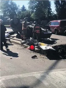  ?? SASKATOON FIRE DEPARTMENT ?? Police and fire crews responded to several collisions throughout the morning commute on Monday. Above, a woman had to be extricated by fire crews after the car she was in overturned following a collision near Taylor Street East and Weyakwin Drive.