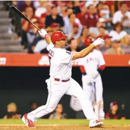  ?? (Reuters) ?? ALBERT PUJOLS hit a pair of three-run homers in his first six-RBI game since 2009, and the Los Angeles Angels remained unbeaten since the All-Star break with their seasonbest fifth straight victory, 8-6 over the Texas Rangers on Tuesday night. Pujols,...