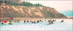  ?? KENDRA CHAPPELL/Special to The Herald ?? Paddlers take to the cold waters of Okanagan Lake in the first stage of The Elevator on Saturday morning. At right, brothers Patrick and Ben Geertz from the Salty’s Youngens, a youth team, work together during The Elevator.