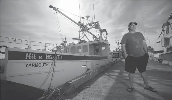  ?? SANDOR FIZLI FOR NATIONAL POST ?? John Symonds stands on the dock in Woods Harbour, N.S. Symonds was a good friend of Katlin Nickerson, a fisherman whose vessel sank in February 2013.