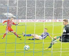  ?? AP ?? Bayern’s James Rodriguez, left, scores his side’s second goal against Schalke.