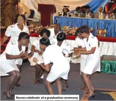  ?? ?? Nurses celebrate at a graduation ceremony