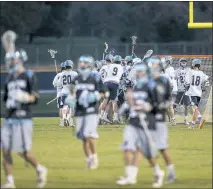  ?? PHOTO BY ROB WORMAN ?? The La Plata Warriors boys lacrosse team celebrates after topping the visiting Huntingtow­n Hurricanes 10-8 on Tuesday evening in a SMAC crossover game.