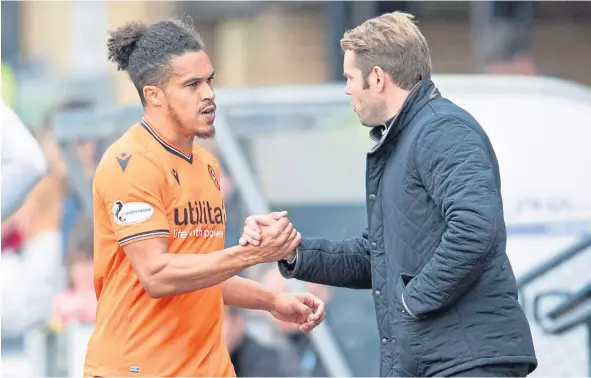  ??  ?? Dundee United boss Robbie Neilson (right) was pleased to get new signing Troy Brown some game time.