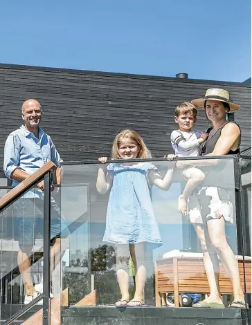  ??  ?? Amanda and Brad Richards on the upper terrace with Willow and Max.