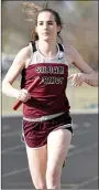  ?? Bud Sullins/Special to the Herald-Leader ?? Caroline Farine runs her leg of the 4x800-meter relay.