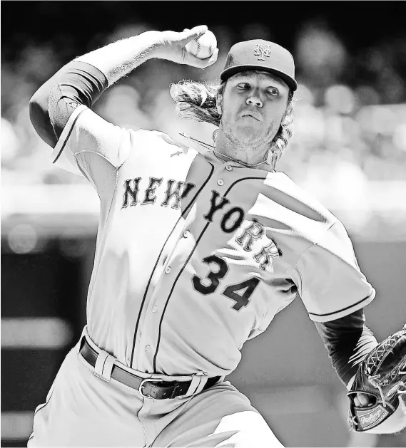  ?? BRAD MILLS, USA TODAY SPORTS ?? Rookie pitcher Noah Syndergaar­d was 4-5 with a 2.97 ERA through his first 13 starts for the Mets.