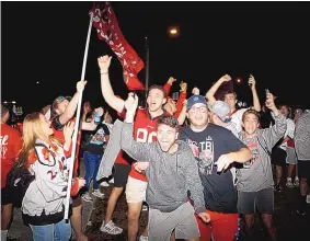  ?? OCTAVIO JONES/TAMPA BAY TIMES/TNS ?? Tampa Bay Buccaneers fans celebrate after Super Bowl 55 near Raymond James Stadium on Sunday, flooding the streets of Tampa and prompting concerns about the spread of a new variant of the virus first found in the U.K.