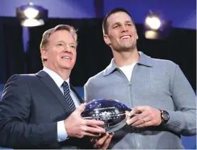  ?? Photo: AP ?? NFL commission­er Roger Goodell and New England Patriots quarterbac­k Tom Brady pose with the MVP trophy