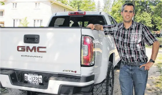  ?? TINA PEPLINSKIE • POSTMEDIA ?? Blake Mitchell hopes he can keep his 2021 GMC Canyon AT4 Diesel for 15 years, so his daughter can drive it.