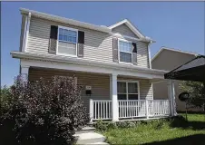  ?? BYRON STIRSMAN / STAFF ?? This home at 2201 E. Third St. is a Lot Links success story. The old property was purchased, torn down and this new home was built on the lot.