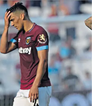  ??  ?? Lost again: Fabian Balbuena and Ryan Fredericks react to defeat by Wolves