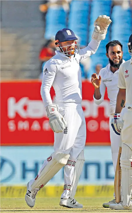  ??  ?? Claiming the advantage: Adil Rashid (centre) savours the dismissal of Virat Kohli, before Alastair Cook (left) goes on the attack