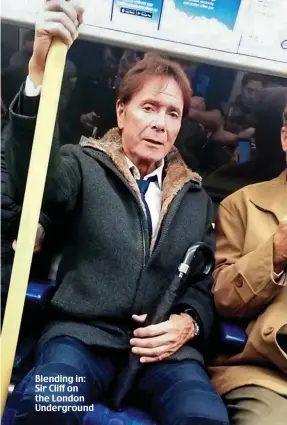  ??  ?? Blending in: Sir Cliff on the London Undergroun­d