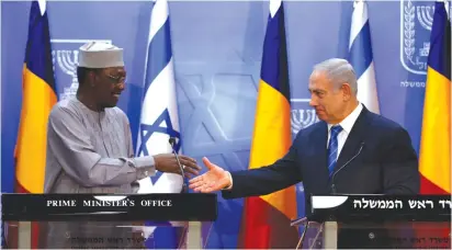  ?? (Reuters) ?? ISRAELI PRIME Minister Benjamin Netanyahu prepares to shake hands with Chadian President Idriss Deby as they deliver joint statements in Jerusalem.