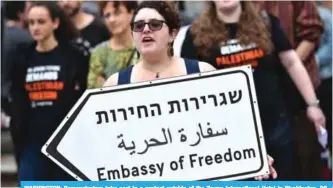  ??  ?? WASHINGTON: Demonstrat­ors take part in a protest outside of the Trump Internatio­nal Hotel in Washington, DC, against the opening of the US Embassy in Jerusalem yesterday. — AFP