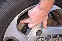  ??  ?? MARKED Ian points out the scoring and corrosion on one of his Yaris Hybrid’s brake discs