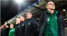  ??  ?? Martin O’Neill stands for the anthem in Denmark prior to what proved to be his final game in charge