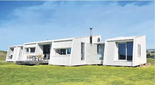  ?? PHOTOS: CHRISTINE O’CONNOR ?? Coastal sanctuary . . . This house is built across its Moeraki site to capitalise on the views. The exterior is painted a soft grey that is close to white.