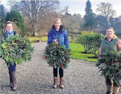  ??  ?? Therapeuti­c New mum Alison Mitchell (centre), Audrey Anderson (left) and Rebecca Flinn (right) attended a wreathmaki­ng workshop in Blair Atholl run by Emma Harvey of Coach House Flowers