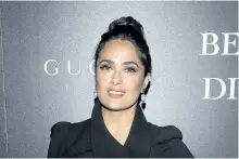  ?? CHARLES SYKES/THE ASSOCIATED PRESS ?? Salma Hayek attends a screening of Beatriz at Dinner in New York on Tuesday. Director Miguel Arteta says the film is a sign of the times.