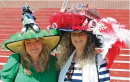  ?? The Sentinel-Record/Tanner Newton ?? ■ For the fifth year, Leslie Murray, left, and Kelly Murray made hats for each other in honor of Derby Day. Each year they make a hat that the other is bound to wear, no matter what it looks like.