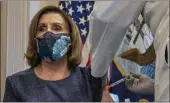  ?? KEN CEDENO — POOL ?? Speaker of the House Nancy Pelosi, D-Calif., receives a Pfizer-BioNTech COVID-19 vaccine shot on Friday.