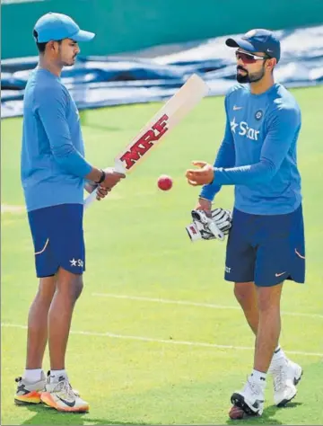  ?? PTI ?? India skipper Virat Kohli gives a pep talk to uncapped batsman Shreyas Iyer at the HPCA stadium on the eve of the final Test against Australia. The Mumbai batsman is expected to make his debut if Kohli doesn’t recover from his right shoulder injury.