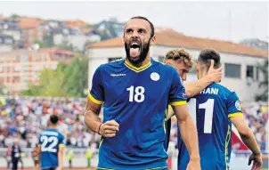  ??  ?? Passion play: Vedat Muriqi celebrates equalising for Kosovo in their 2-1 defeat of the Czech Republic yesterday; Shefki Kuqi, pictured below celebratin­g a goal for Crystal Palace in 2008, is a fervent supporter of the national team