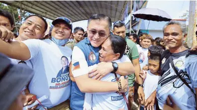  ?? ?? Sen. Bong Go hugs a supporter during a visit to Cateel town in Davao Oriental on Friday.