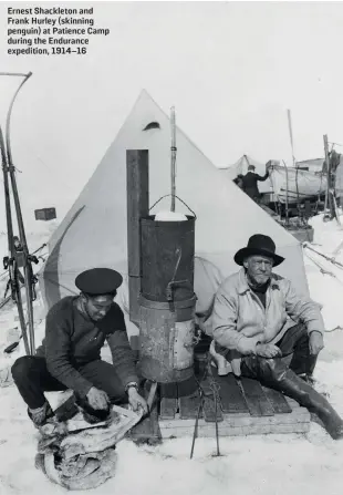  ?? ROYAL GEOGRAPHIC­AL SOCIETY (WITH IBG) PICTURE LIBRARY ?? Ernest Shackleton and Frank Hurley (skinning penguin) at Patience Camp during the Endurance expedition, 1914–16