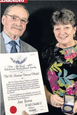  ??  ?? Winner Ann Burns with George Anderson of the Royal Caledonian Horticultu­ral Society.