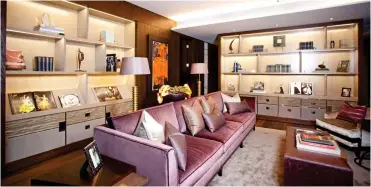  ??  ?? Lap of luxury: A reception room, with purple sofa, in one of the apartments in the complex