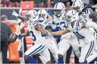  ?? ERIC CHRISTIAN SMITH THE ASSOCIATED PRESS ?? Indianapol­is Colts cornerback Kenny Moore, left, celebrates after making an intercepti­on at Houston on Saturday.