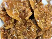  ?? COURTESY OF NEW ORLEANS SCHOOL OF COOKING ?? Pralines, a sweet Creole confection adapted from a recipe brought by French settlers, give a great taste of New Orleans.