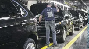  ?? CHRIS YOUNG/THE CANADIAN PRESS ?? New Ford Edges sit on a production line at the plant in Oakville, Ont. New NAFTA rules could raise the cost of a car by hundreds or even thousands of dollars, say industry experts.