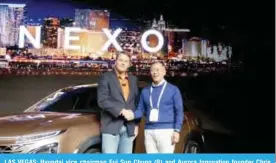  ??  ?? LAS VEGAS: Hyundai vice chairman Eui Sun Chung (R) and Aurora Innovation founder Chris Urmson present the Nexo, a hydrogen fuel-cell powered vehicle, at the Internatio­nal Consumer Electronic­s Show. — AFP