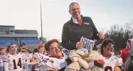  ?? ?? Brian A. Pounds/Hearst Connecticu­t Media
New Canaan Coach Lou Marinelli is carried from the field on the shoulders of players Javier Perez-Soto, left, and Will Pepe following their 16-13 victory over Maloney in the CIAC Class L championsh­ip at CCSU’s Arute Field in New Britain on Dec. 10. The Rams will open their season at Shelton in an alliance game.