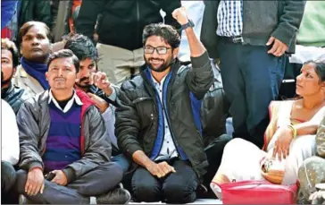  ?? MONEY SHARMA/AFP ?? Member of the legislativ­e assembly from Gujarat and social activists Jignesh Mevani (centre) gestures during a rally in New Delhi on January 9.