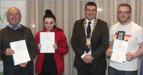  ??  ?? Cllr Tommy Annesley with Eddie Fitzgerald, Holly Farrell and Niall Kinsella, who earned a Certificat­e in Digital Film-making.