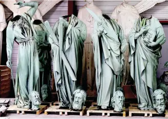  ??  ?? FOR RESTORATIO­N — Statues removed for restoratio­n from the sire of Notre Dame Cathedral are stored at a workshop in Marsac sur L’Isle, near Bordeaux, France. (EPA)