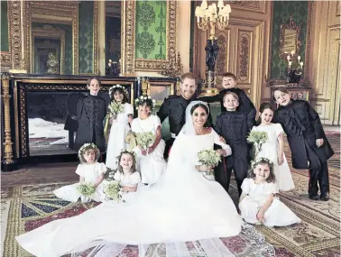  ?? ALEXI LUBOMIRSKI/KENSINGTON PALACE VIA THE ASSOCIATED PRESS ?? Kensington Palace has released some of the official wedding photograph­s of Prince Harry and Meghan Markle, who were married near London on Saturday. The couple is shown with, from left, standing, Brian Mulroney, Remi Litt, Rylan Litt, Jasper Dyer,...