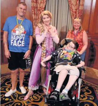  ??  ?? Cerebral palsy sufferer Leon Mason, at Disney World, pictured with dad David, mum Angela and an actress playing Rapunzel, was hospitalis­ed in Florida after suffering a collapsed lung