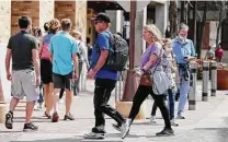  ?? Kin Man Hui / Staff file photo ?? People visit the Pearl on March 10, eight days after Gov. Greg Abbott lifted Texas’ mask mandate.