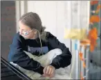  ?? COURTESY ?? After being discharged from the hospital, Lilly Downs, 17, still has to take liquid food through a tube at her home in Golden, Colorado, on Sept. 17.