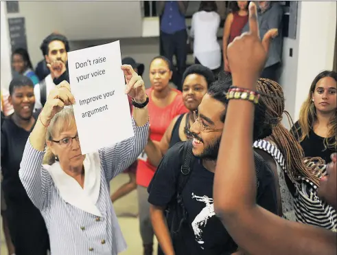  ??  ?? UNREST: UCT lecturer Dr Talit Reisenberg­er is mocked after she unsuccessf­ully tries to quell the protest that moved into her department. Students protested again yesterday for, among other things, the removal of the Rhodes statue. What is needed, says...