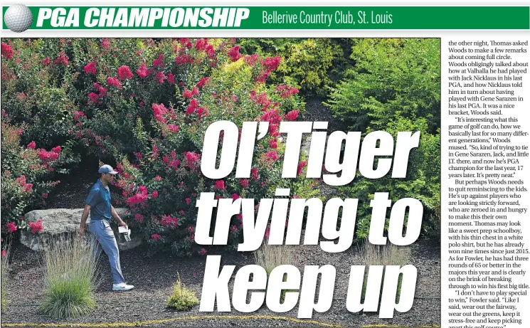  ?? — GETTY IMAGES ?? Tiger Woods walks the third hole during the first round of the PGA Championsh­ip yesterday at Bellerive. Woods fought back to shoot an even-par 70.