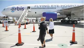  ??  ?? Google hosted the Orbis Flying Eye Hospital Thursday at Moffett Field in Mountain View. The mobile medical center visited Silicon Valley as part of Orbis’ push to connect with technologi­cal innovators and philanthro­pists on its mission to end “curable...