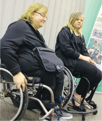  ?? MICHELLE BERG ?? Heather Kuttai, mother of a wheelchair basketball player, and Chelsea Seib, an 11-year-old wheelchair basketball player, hope that 34 specialize­d sports wheelchair­s that were stolen will be returned.