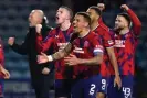  ?? Milligan/PA ?? Rangers players celebrate at the final whistle at Kilmarnock. Photograph: Andrew